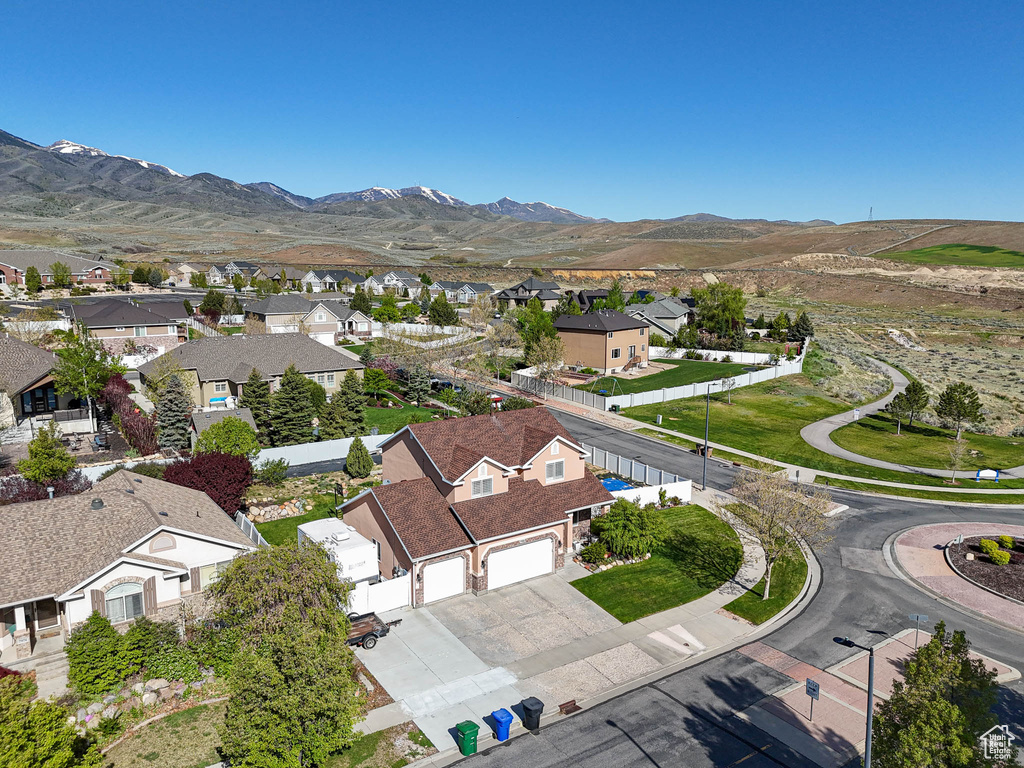Aerial view of residential area with a mountain backdrop