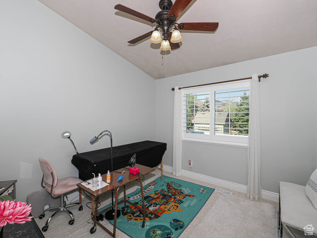 Office with a ceiling fan, vaulted ceiling, and baseboards
