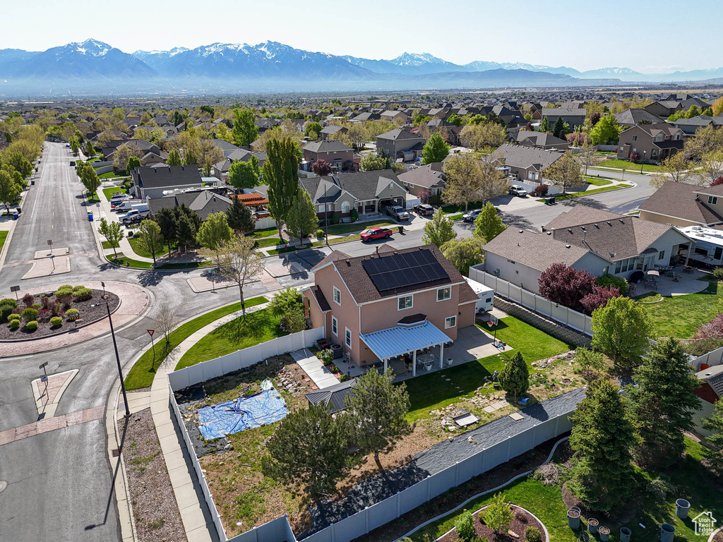 Aerial perspective of suburban area featuring a mountainous background