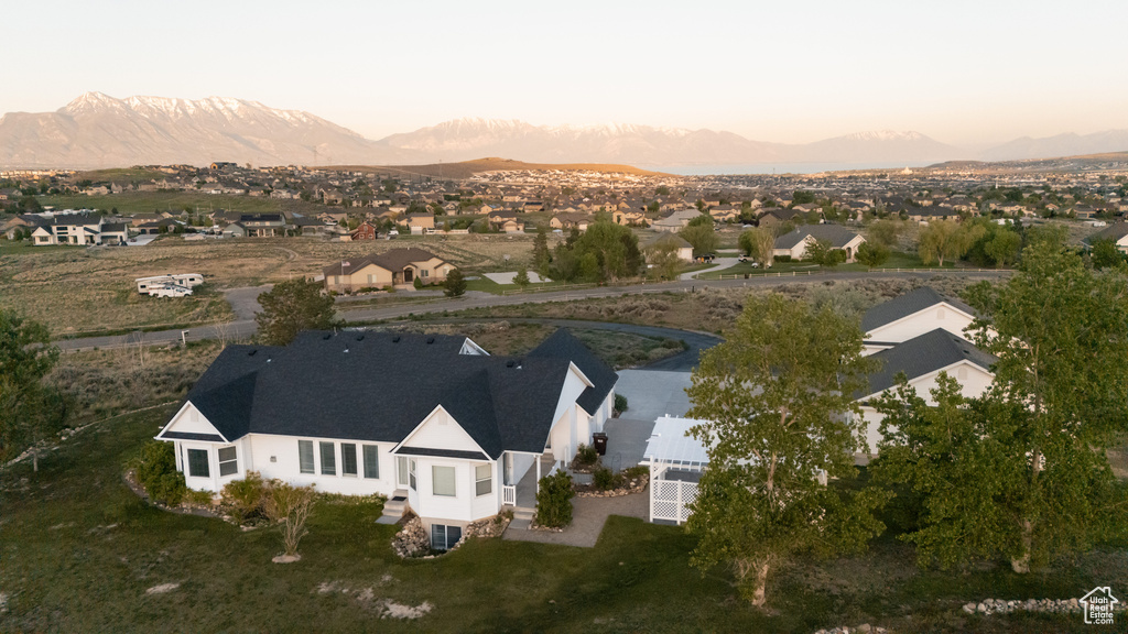 Aerial view of property and surrounding area featuring mountains