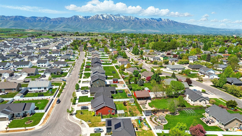 Aerial view of residential area featuring a mountainous background