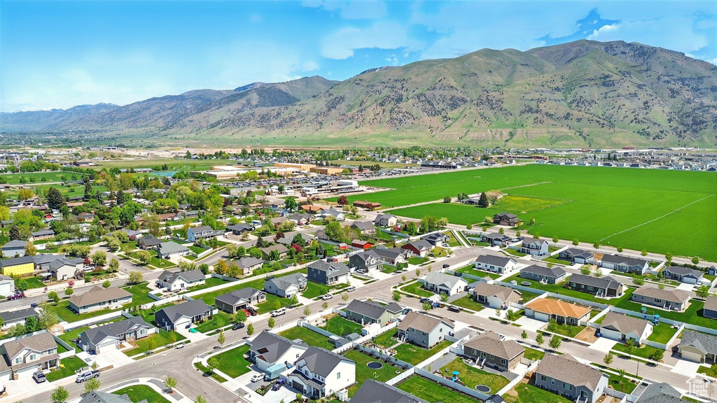 Aerial view of property's location with a mountainous background