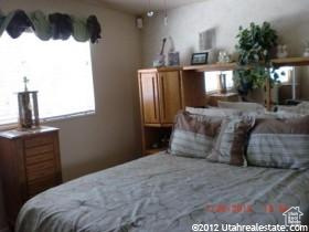 Bedroom with multiple windows