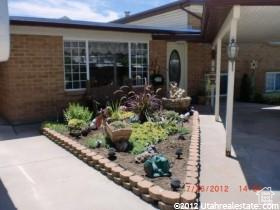 Entrance to property featuring brick siding