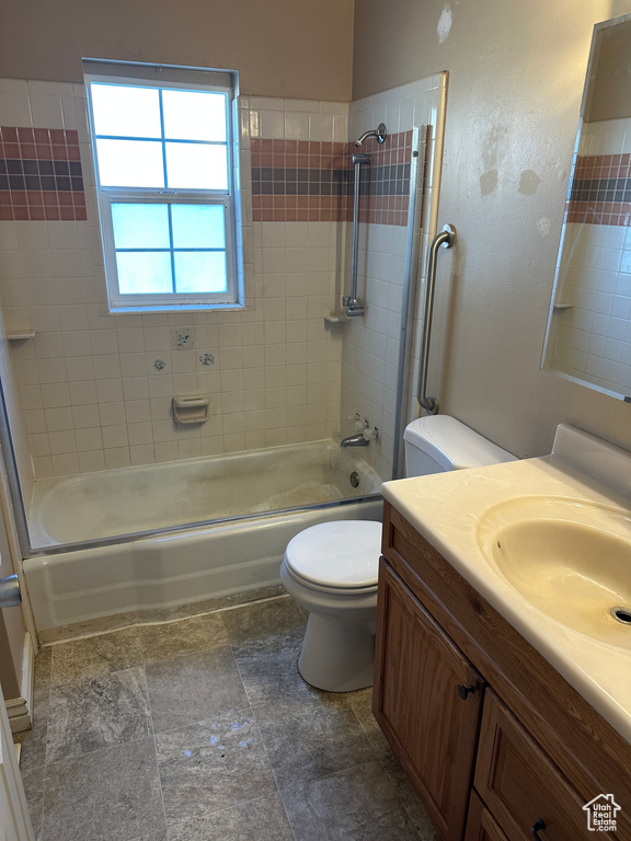 Full bathroom with toilet, shower / bath combination, and vanity
