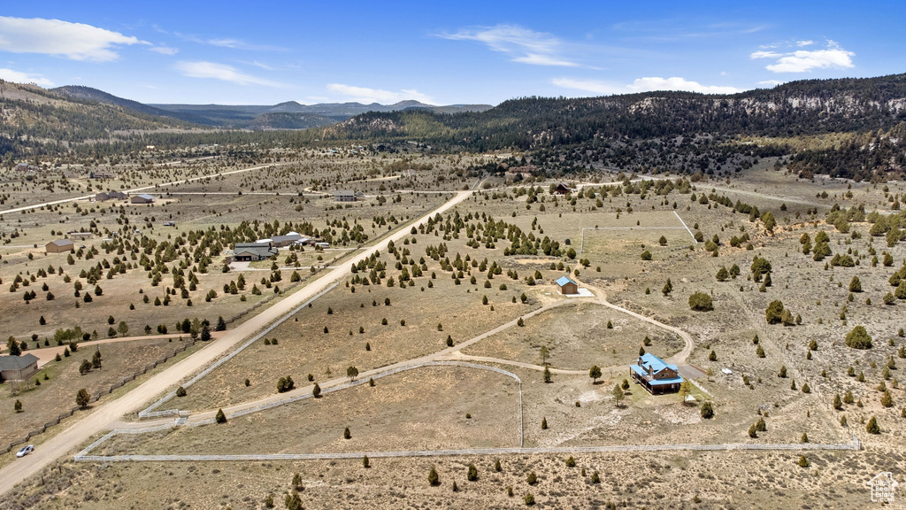 Aerial view of sparsely populated area featuring a desert landscape and mountains