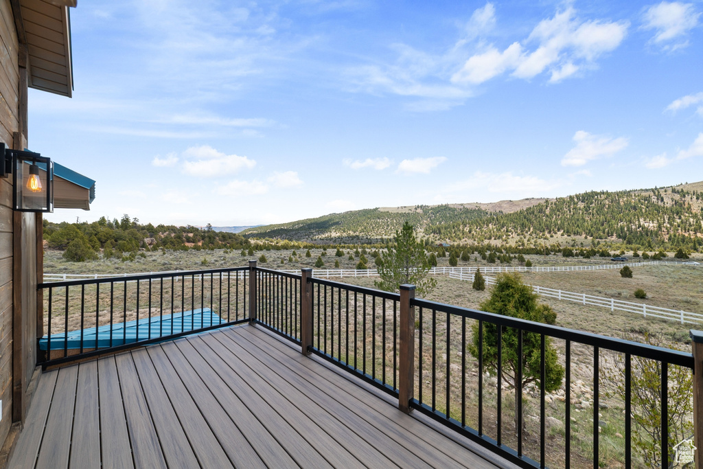 Wooden deck featuring a mountain view