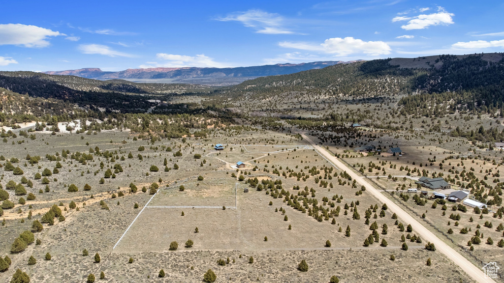 View of rural area with a mountain backdrop and a desert landscape