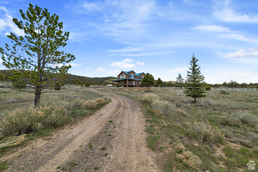 View of dirt / gravel road featuring a view of countryside