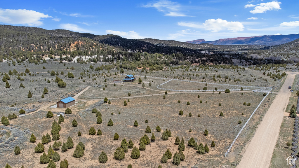 View of rural area featuring a desert landscape and a mountain backdrop