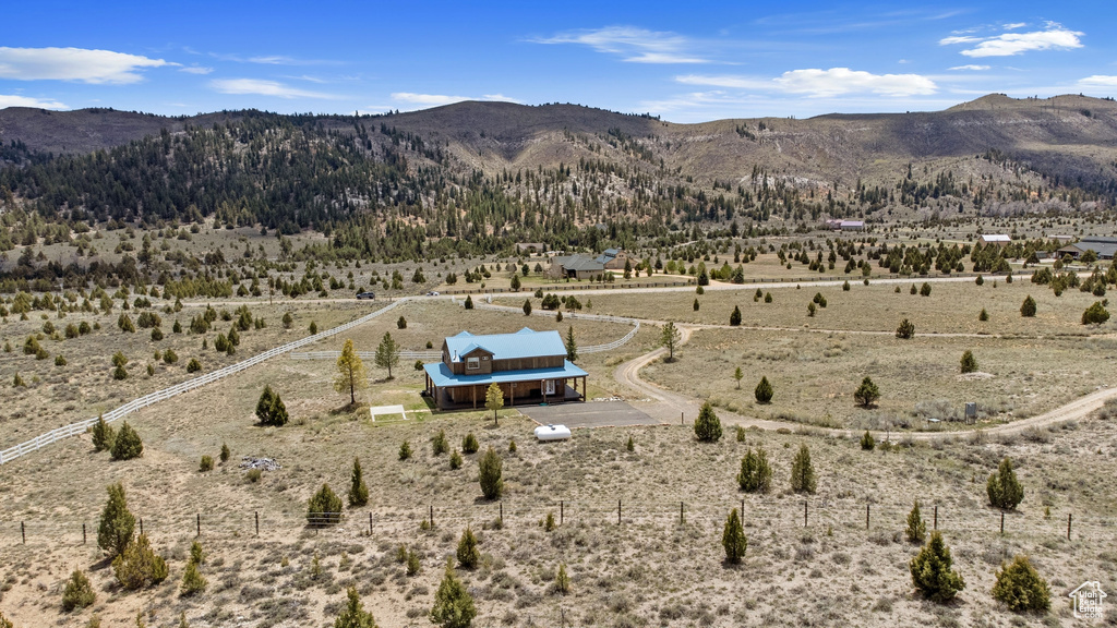 View of mountain backdrop featuring rural landscape