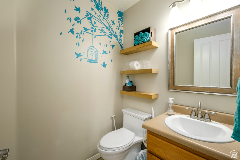 Bathroom featuring toilet and vanity