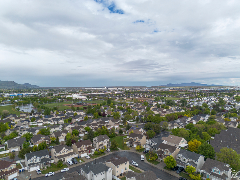 Aerial perspective of suburban area featuring a mountainous background