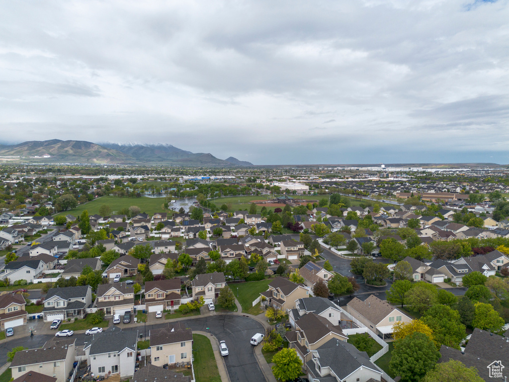 Aerial view of property\'s location with a mountainous background and nearby suburban area