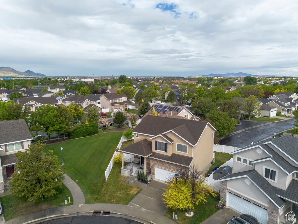 Aerial perspective of suburban area featuring a mountain backdrop