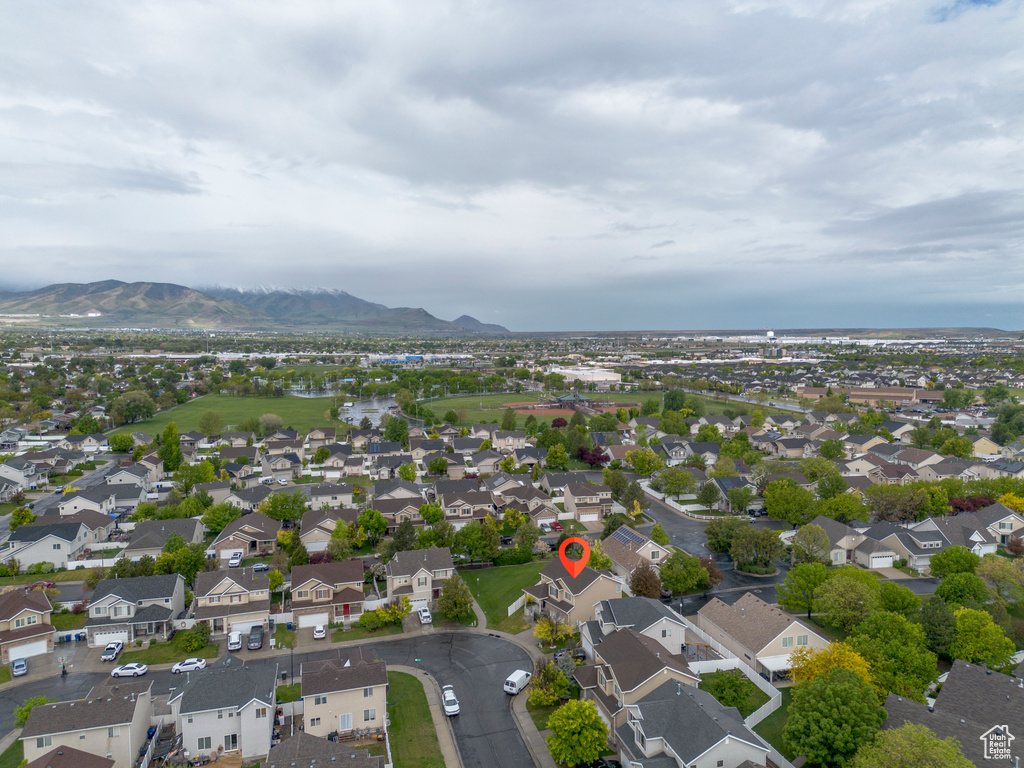 View of property location featuring mountains and nearby suburban area