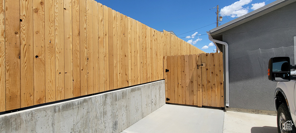 View of patio with fence