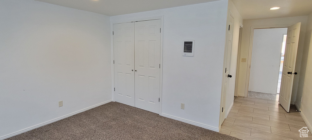Unfurnished bedroom featuring recessed lighting, a closet, and baseboards