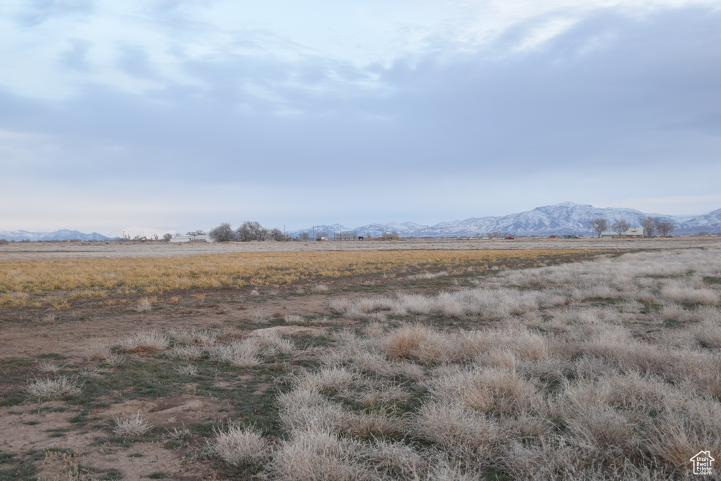 View of mountain backdrop with rural landscape