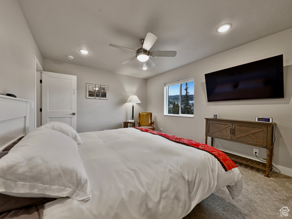Carpeted bedroom with recessed lighting, ceiling fan, and baseboards