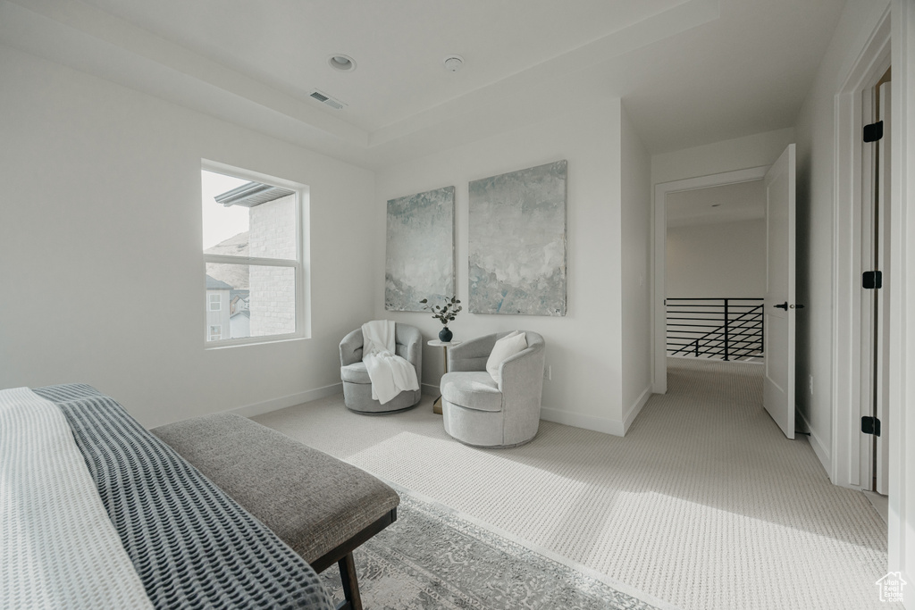 Bedroom featuring carpet flooring and baseboards