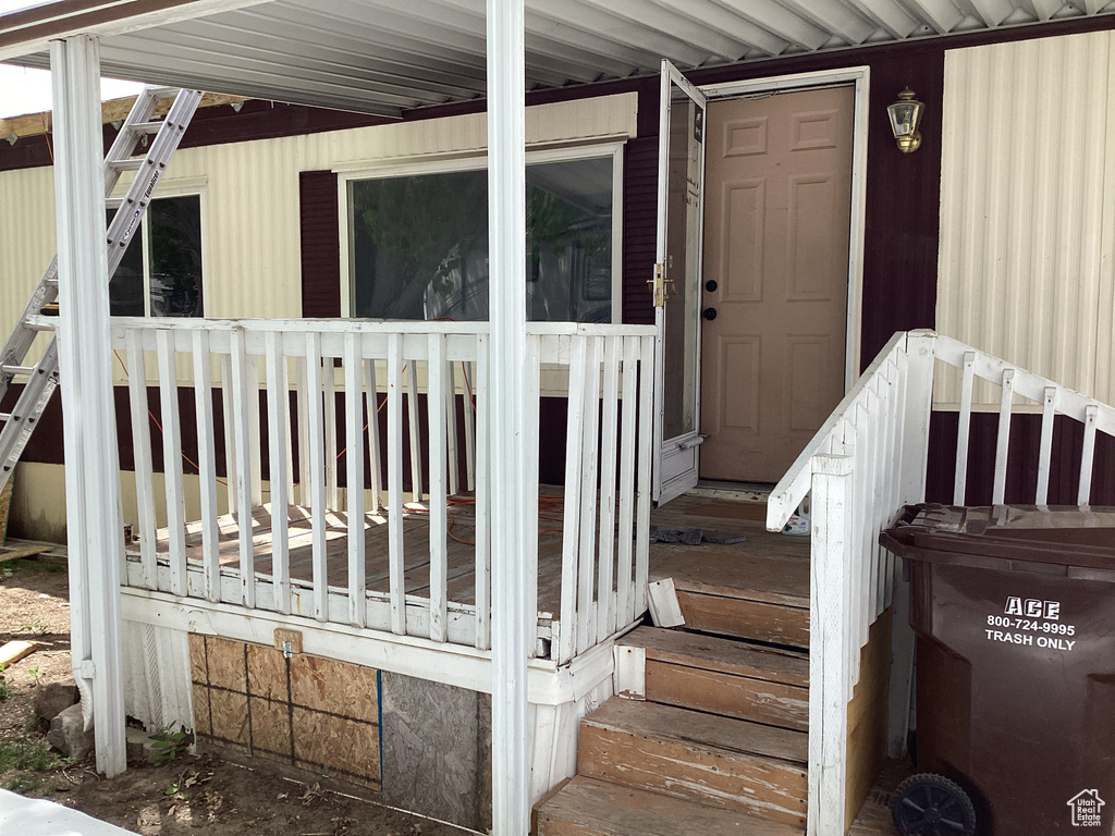 Entrance to property featuring a porch