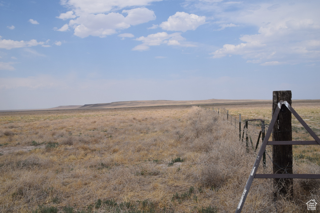 View of yard featuring a view of rural / pastoral area and fence