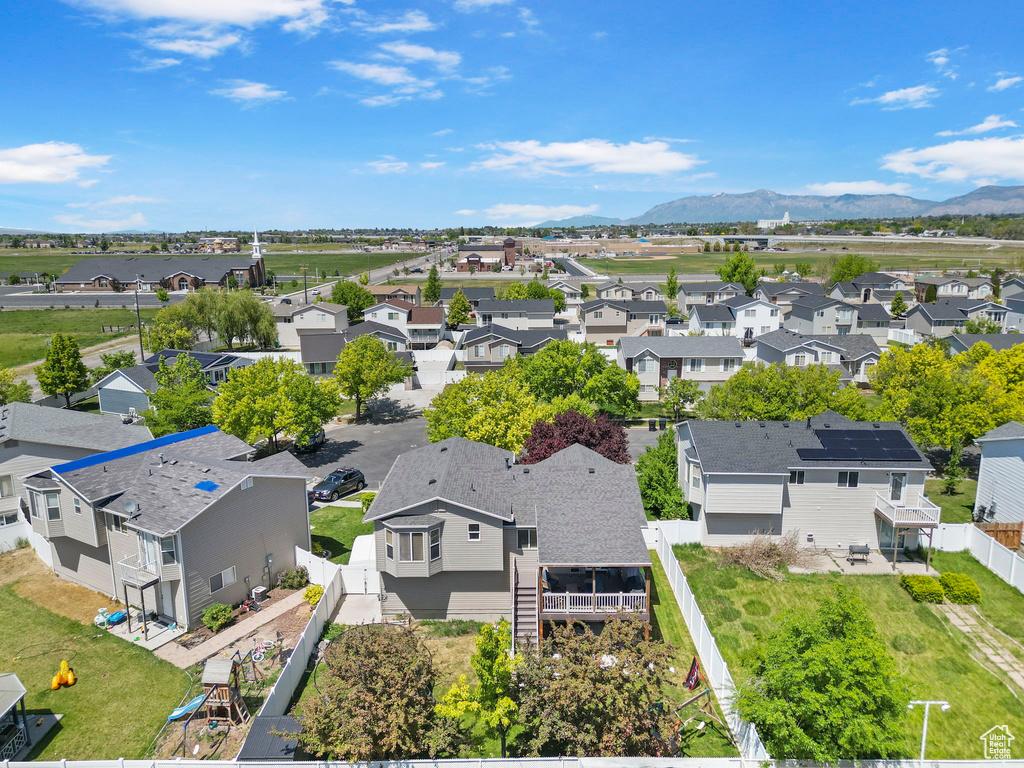 Aerial view of residential area with a mountain backdrop