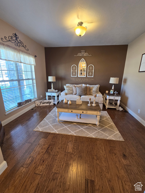 Living room featuring wood finished floors and baseboards