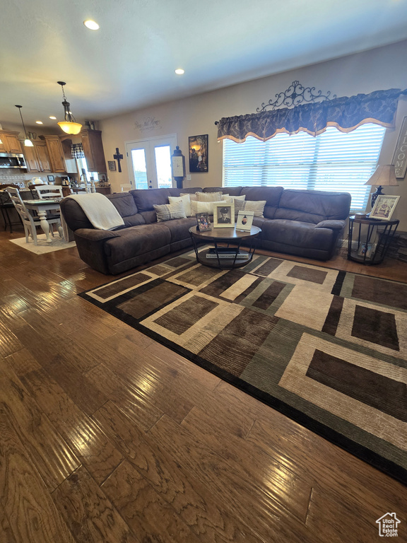 Living room featuring dark wood-style floors and recessed lighting
