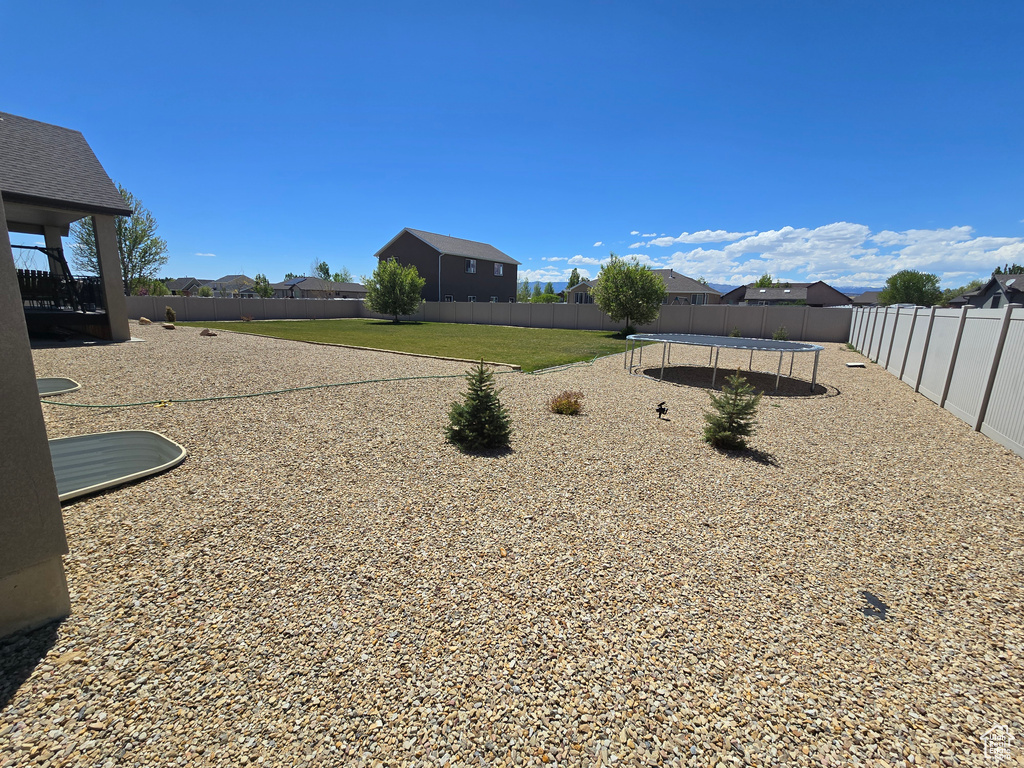 View of yard featuring a trampoline