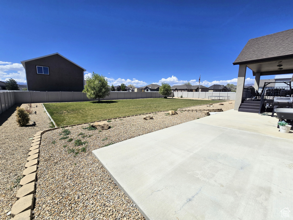 View of yard featuring a patio area and a residential view