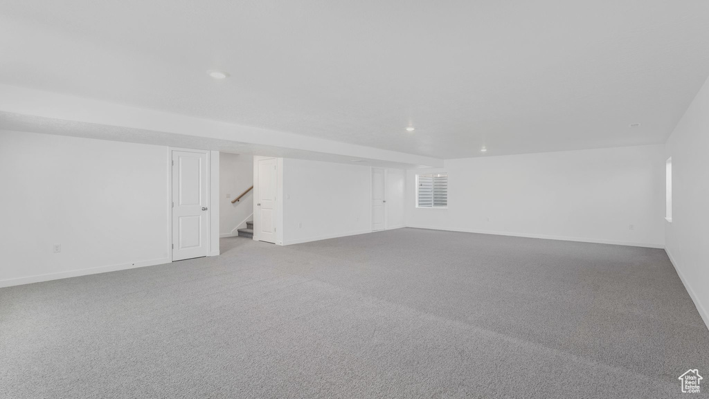Additional living space featuring stairs, recessed lighting, baseboards, and carpet floors