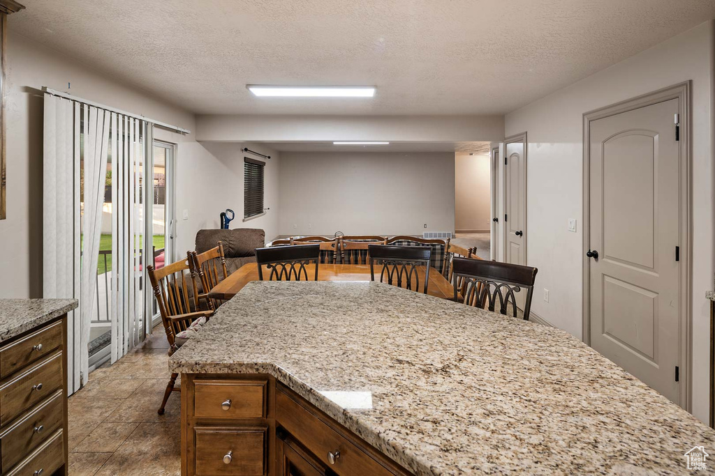 Dining area with a textured ceiling