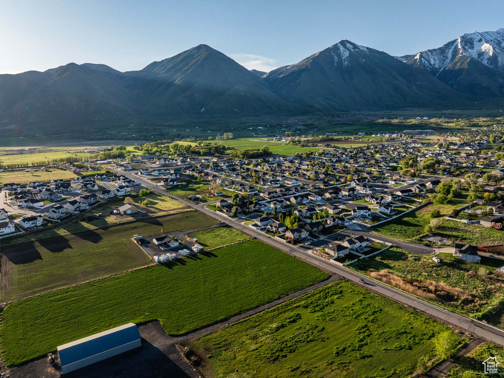 Aerial perspective of suburban area with a mountainous background