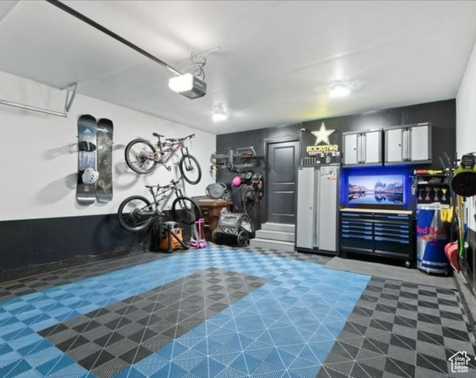 Garage featuring a garage door opener