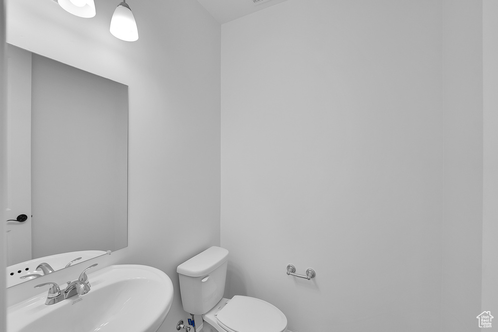 Bathroom featuring a sink and toilet