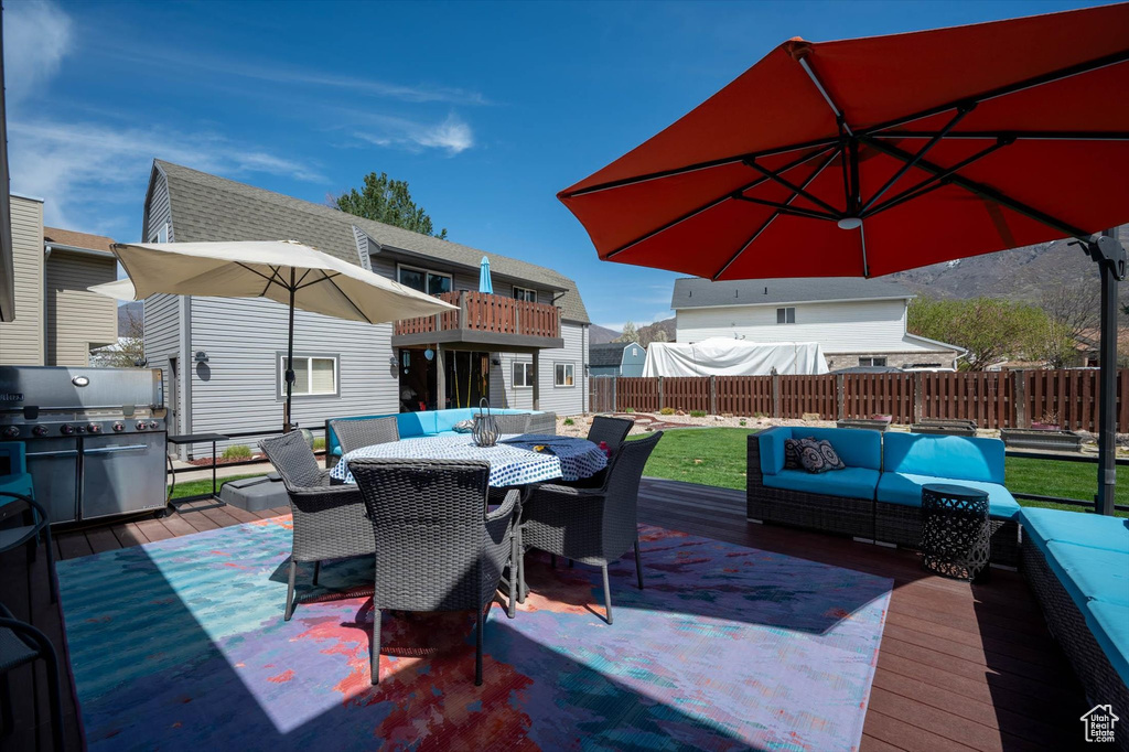 Wooden deck featuring outdoor lounge area and outdoor dining area