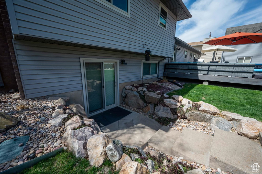 Back of house with a wooden deck