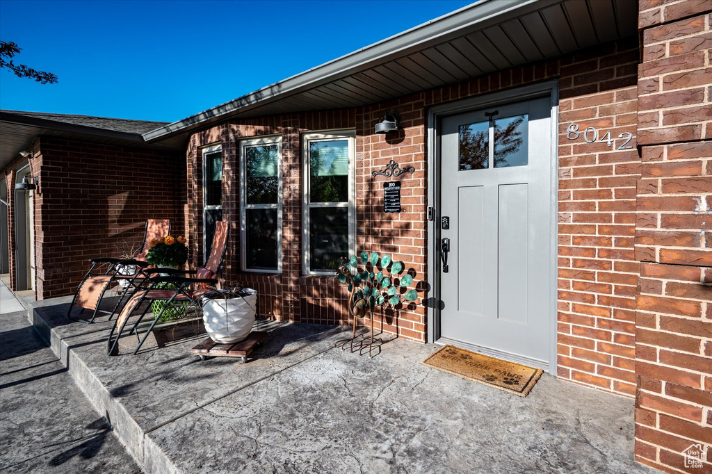 Property entrance with brick siding