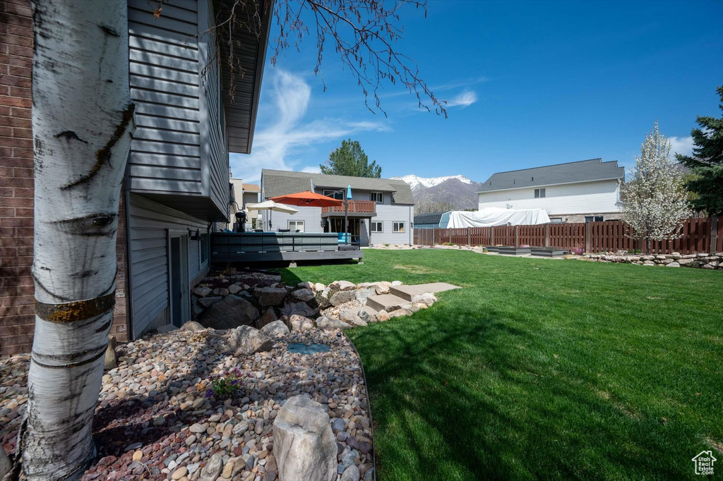 View of yard with a deck