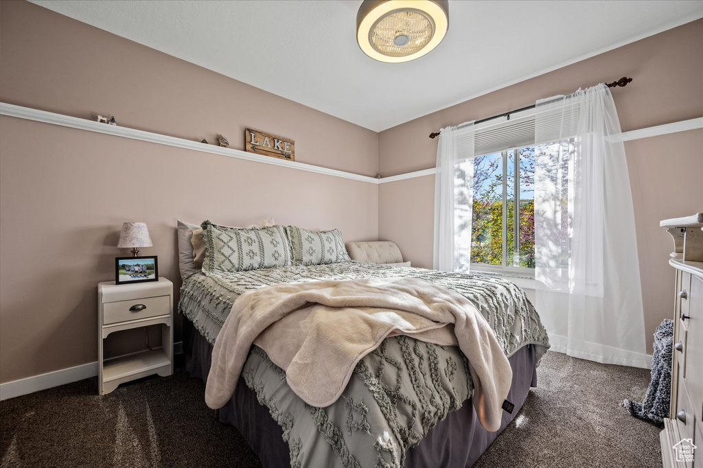 Carpeted bedroom with baseboards