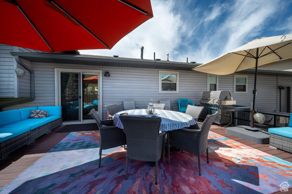 View of patio with a grill, an outdoor living space, and outdoor dining space