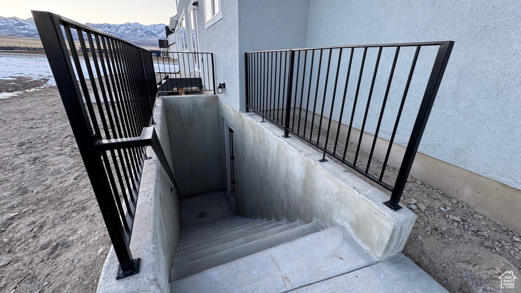 Staircase featuring a mountain view
