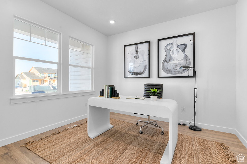 Office area with wood finished floors, baseboards, plenty of natural light, and recessed lighting