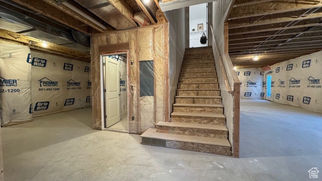 Stairs featuring concrete floors