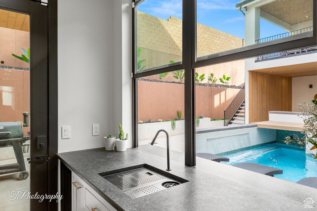 View of swimming pool featuring a sink