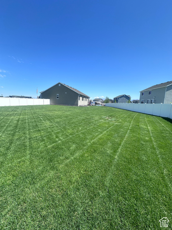 View of yard featuring fence