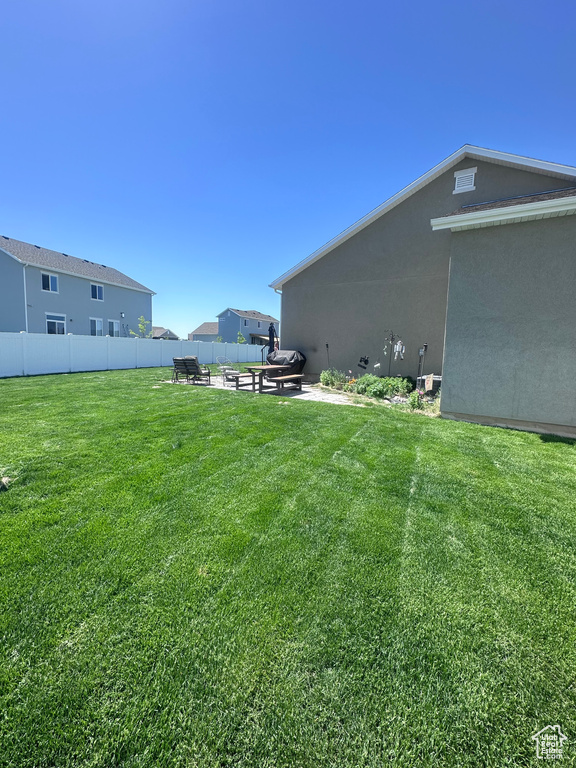 View of yard with a patio area