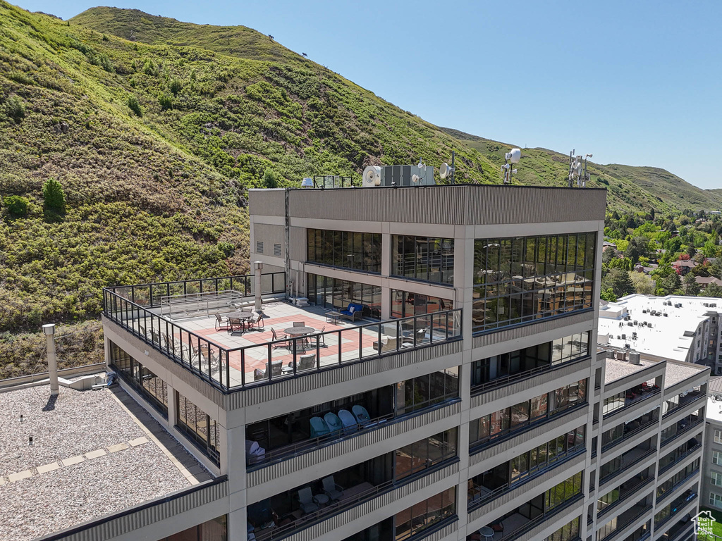 Back of property with a mountain view